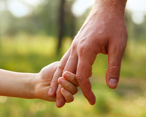 father holding sons hand benefits of life insurance louisville ky evansville il