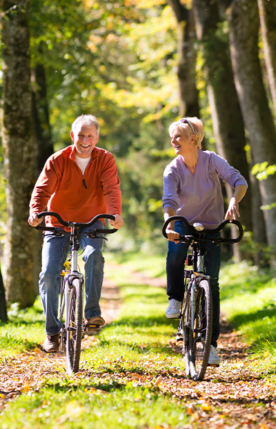 happy couple on bikes understanding annuities louisville ky evansville il