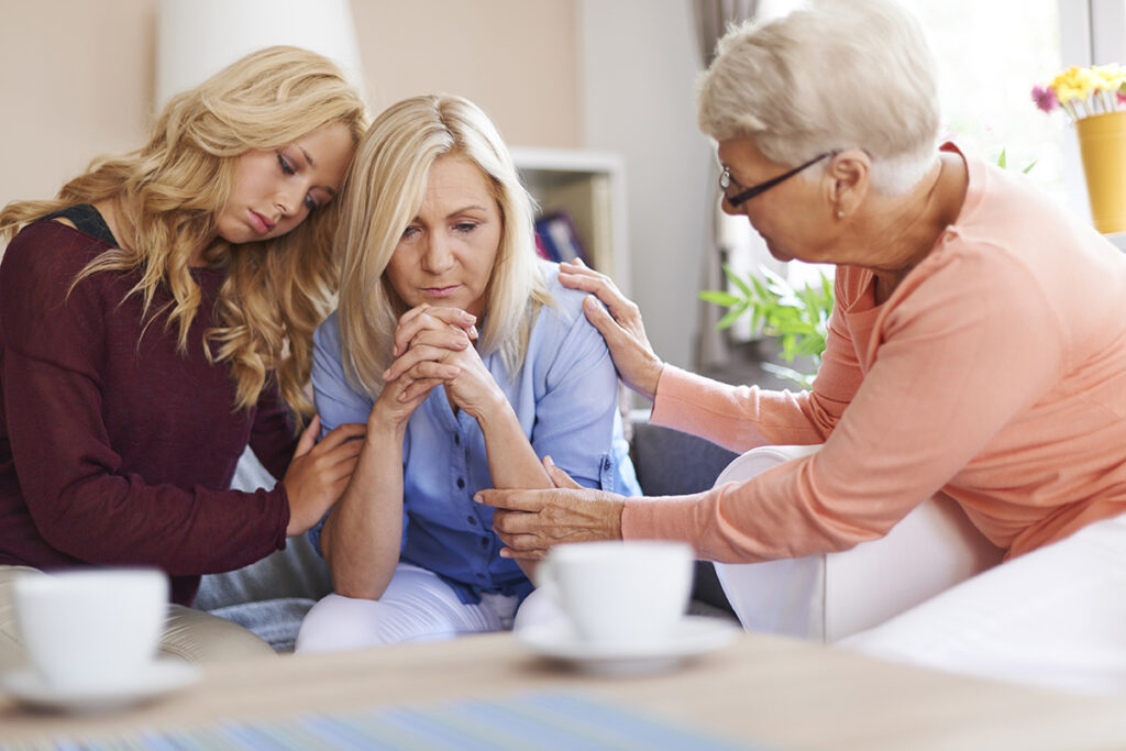 prolonged grief disorder family grieving on couch together